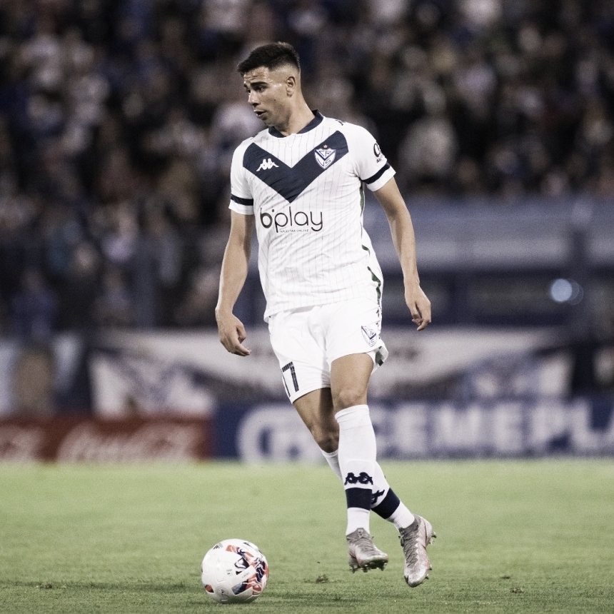 Lautaro Gianetti of Argentina's Velez Sarsfield, top, heads the