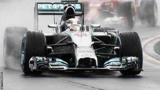 Hamilton takes pole in wet Malaysian qualifying