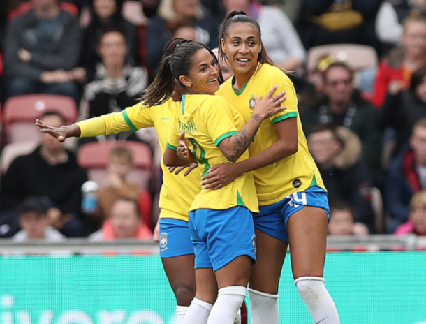 North Carolina Courage midfielder Debinha (left) celebrates her goal against England. (Photo by Ian MacNicol/Getty Images)