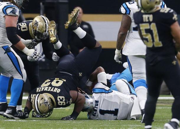 David Onyemata (93) tackles QB Cam Newton (1) in a day where the Saints defense reined supreme (AP Photos)