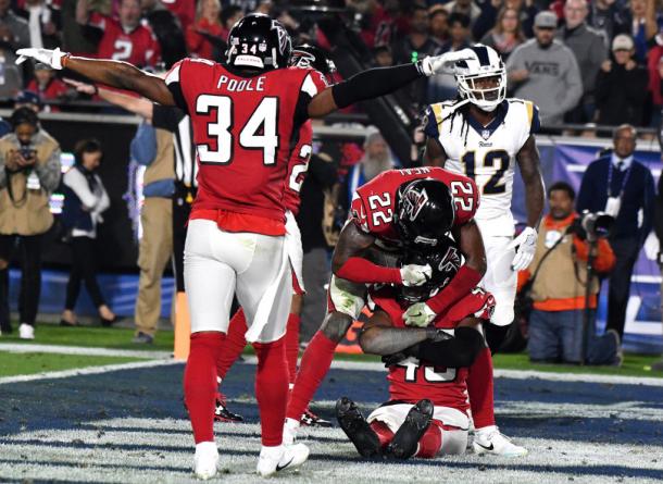 Brian Poole (34) and Keanu Neal (22) react to teammate Deion Jones (44) breaking up a pass intended for Sammy Watkins (12) in their win over the Rams (Pasadena Star-News/SCNG/Keith Birmingham)