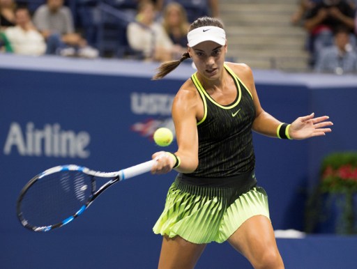 Ana Konjuh hits a forehand return to Agnieszka Radwanska during their fourth round match at the U.S. Open/Don Emmert/AFP