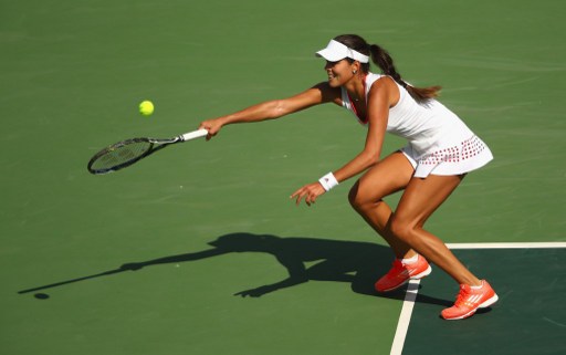 Ana Ivanovic reaches for a forehand in her first round Olympic match in Rio/Photo: Clive Brunskill/Getty Images