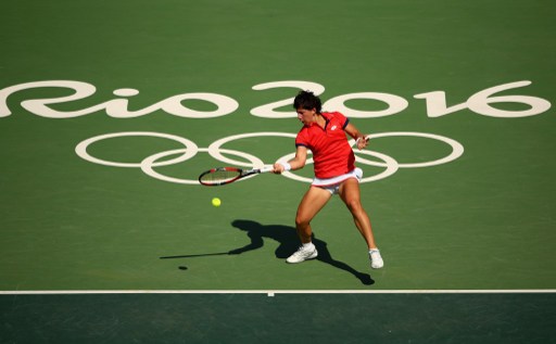 Carla Suarez Navarro plays a forehand against Ana Ivanovic during their first round match at the Olympics/Photo: Clive Brunskill/Getty Images