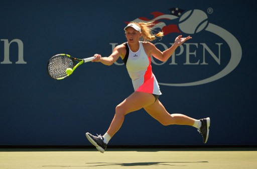 Caroline hits a running forehand against Taylor Townsend during the U.S. Open/Photo: Alex Goodlett/Getty Images
