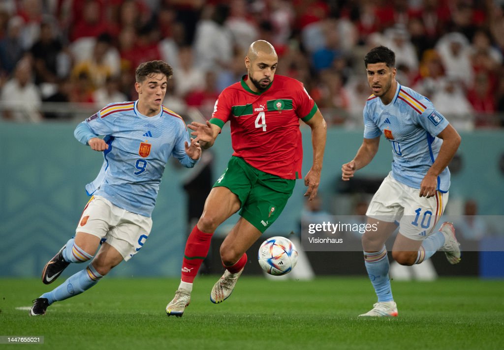 Sofyan Amrabat of Morocco and Pablo Martin Gavi of Spain during the FIFA World Cup Qatar 2022 Round of 16 match between Morocco and Spain at Education City Stadium on December 06, 2022 in Al Rayyan, Qatar. (Photo by Visionhaus/Getty Images)