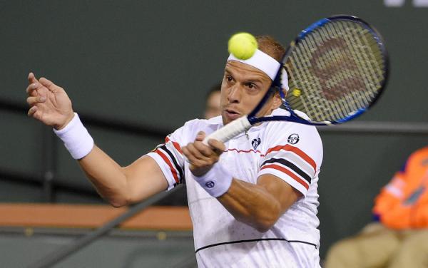 Gilles Muller, of Luxembourg returns a shot to Rafael Nadal, of Spain, at the BNP Paribas Open tennis tournament, Sunday, March 13, 2016, in Indian Wells, Calif. (AP Photo/Mark J. Terrill)