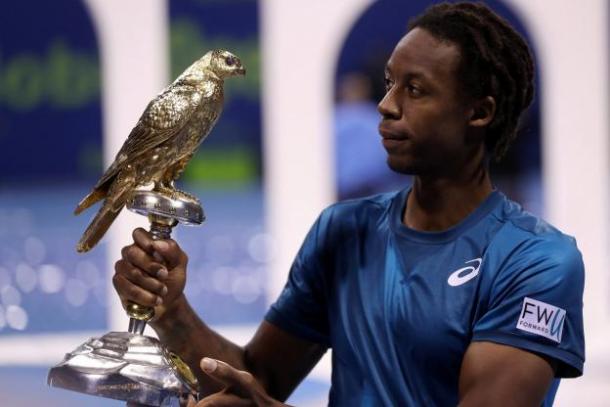 Gael Monfils holds the trophy it took him four finals to finally win. Photo: Reuters