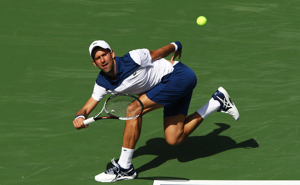 Novak Djokovic chases down a forehand during his loss to Daniel. Photo: Adam Pretty/Getty Images