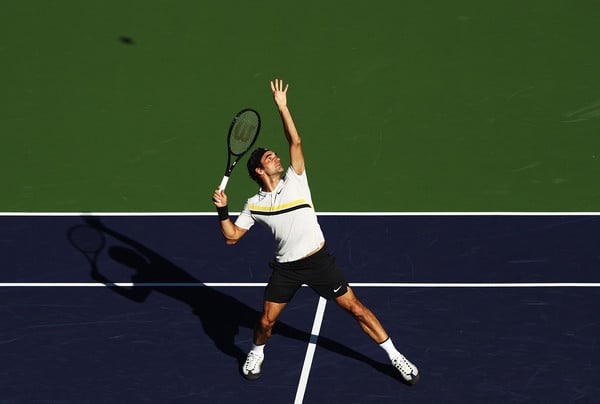 Roger Federer lines up an overhead during his second-round win in Indian Wells. Photo: Adam Pretty/Getty Images