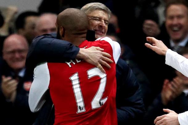 Henry and Wenger embrace following his comeback goal in 2012. | Source: 101greatgoals