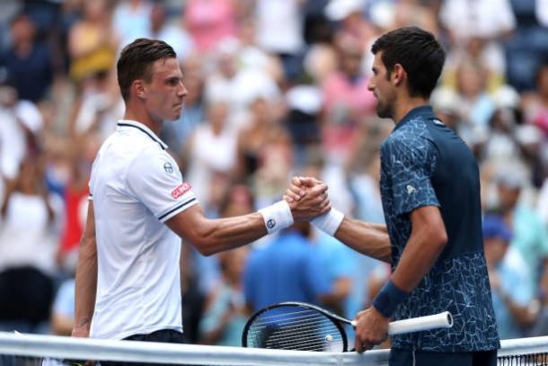 Fucsovics and Djokovic, who were both visited by the doctor during the match, greet each other at the end of the match (Getty Images/Matthew Stockman)
