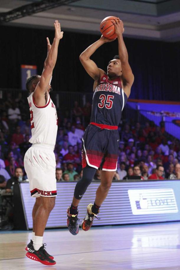 Trier shoots over Freeman in the Bahamas/Photo: Tim Aylen/Associated Press