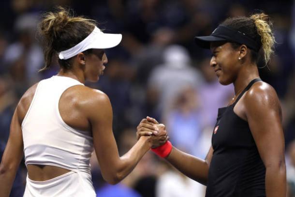 Osaka (right) and Keys (left) embrace each other at the net after the end of their match. (Matthew Stockman/Getty Images Sport)