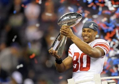 Victor Cruz lifts the Vince Lombardi trophy after the Giant's Super Bowl XLI win | Source: Kirby Lee/Image of Sport-US PRESSWIRE