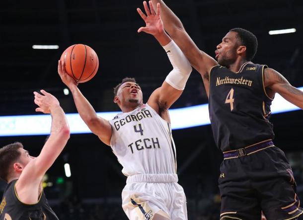 Georgia Tech's Brandon Alston drives to the basket against Northwestern's Vic Law/Photo: Curtis Compton/Atlanta Journal-Constitution via Getty Images