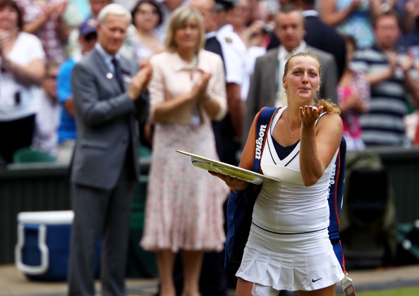 Kvitova bids a goodbye kiss to the crowd after the trophy presentation ceremony in 2011 where she won her first Grand Slam title. Photo credit: Clive Brunskill/Getty Images.