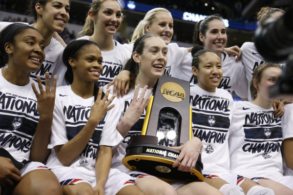 Apr 5, 2016; Indianapolis, IN, USA; The Connecticut Huskies players pose for a photo with their trophy after defeating the Syracuse Orange 82-51 at Bankers Life Fieldhouse. Credit: Brian Spurlock-USA TODAY Sports