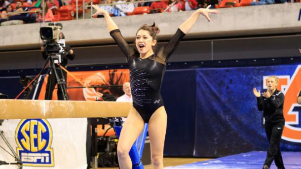 Rachel Schick celebrates after performing on balance beam for Georgia against Auburn in Auburn/Georgia Athletics