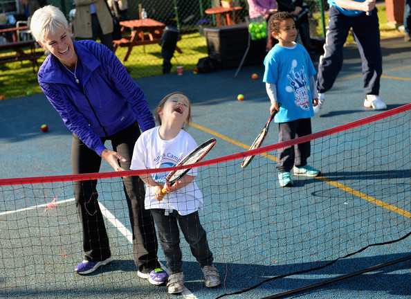 udy Murray helps a young tennis fan during The Great British Tennis Weekend Launch at Will to Win Tennis Club in 2014 (Photo: Christopher Lee/Getty Images) 