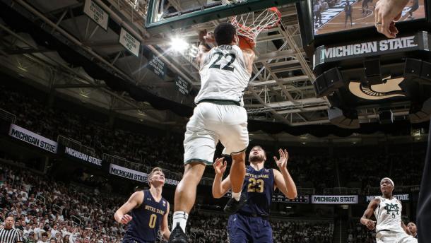 Miles Bridges dunks over two Notre Dame players/Photo: Michigan State athletics website