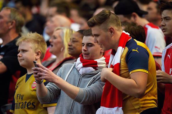 Arsenal fans finding the news from Newcastle. | Source: Mike Hewitt/Getty Images