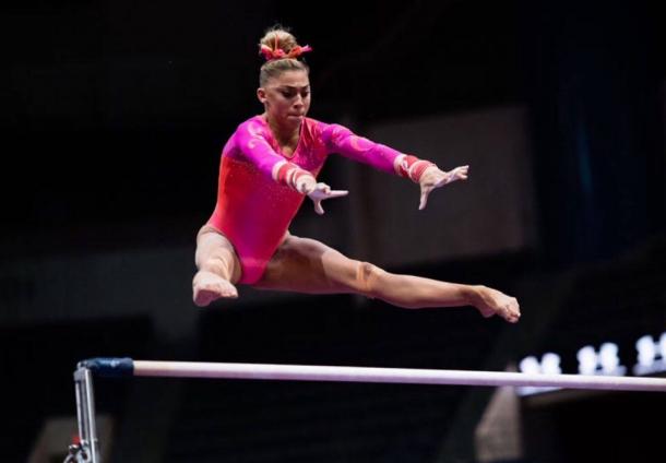 Ashton Locklear performs on the uneven bars at the Secret US Classic in Hartford/Getty Images