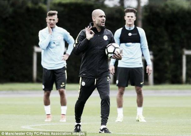 Above: Pep Guardiola taking charge of a Manchester City training session | Photo: Manchester City FC/Press Association Images