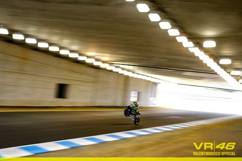 Rossi doing a wheelie through the tunnel in Japan