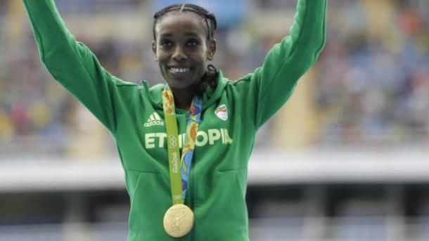 Ethiopia's Almaz Ayana waves to the crowd in Rio after she shattered the world record in the 10,000 meters to win the Olympic title/Photo: Associated Press