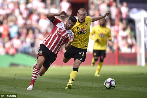 Above: Shane Long been brought down by Ben Watson in Southampton's 1-1 draw with Watford | Photo: Reuters