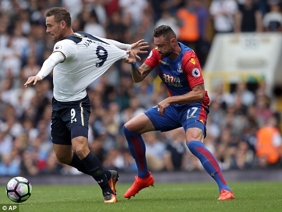 Spurs new man Vincent Janssen protects the ball from the eager Damien Delaney