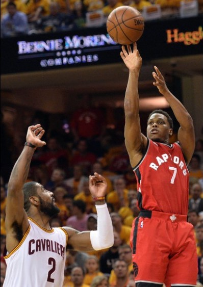 Toronto Raptors guard Kyle Lowry (7) takes a shot over Cleveland Cavaliers guard Kyrie Irving (2). Photo: USA Today Sports