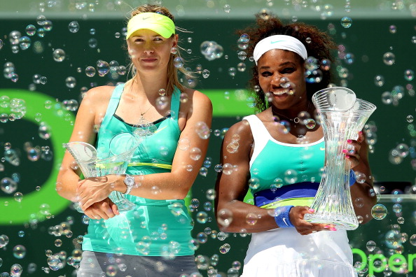 Serena Williams poses with Maria Sharapova after the 2013 Sony Open Tennis Final in Miami, Florida/Getty Images