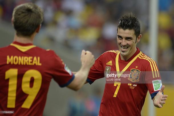 Spain's forward David Villa (R) celebrates with teammate Nacho Monreal after scoring against Tahiti during their FIFA Confederations Cup Brazil 2013 Group B football match, at the Maracana Stadium in Rio de Janeiro on June 20, 2013. AFP PHOTO / LLUIS GENE (Photo credit should read LLUIS GENE/AFP/Getty Images)