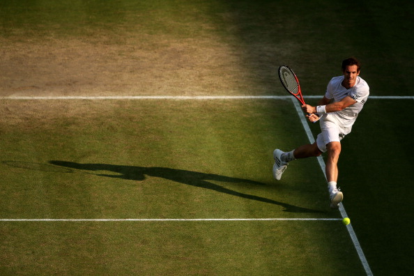 Andy Murray plays a backhand during his semifinal match against Jerzy Janowicz at Wimbledon 2013. (Photo by Clive Brunskill/Getty Images)