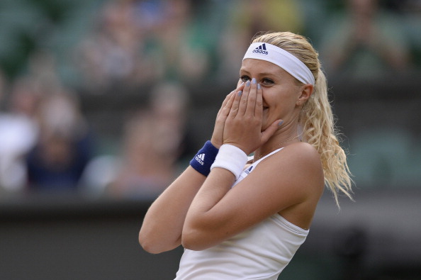 An elated Mladenovic after her first major win in the mixed doubles at Wimbledon 2013 | Photo: Adrian Dennis/Getty Images