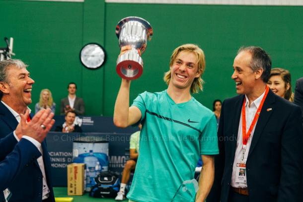 A beaming Denis Shapovalov hoists the National Bank Challenger Trophy after defeating Ruben Bemelmans in the final of the 2017 Drummondville National Bank Challenger. | Photo courtesy of the Drummondville National Bank Challenger