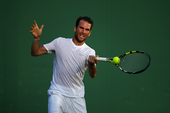 Adrian Mannarino surviving a five-set thriller (Photo: David Ramos/Getty Images)