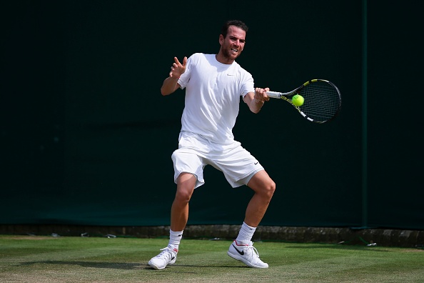 Adrian Mannarino strikes a forehand shot (Photo: Daniel Leal-Olivas/Getty Images)