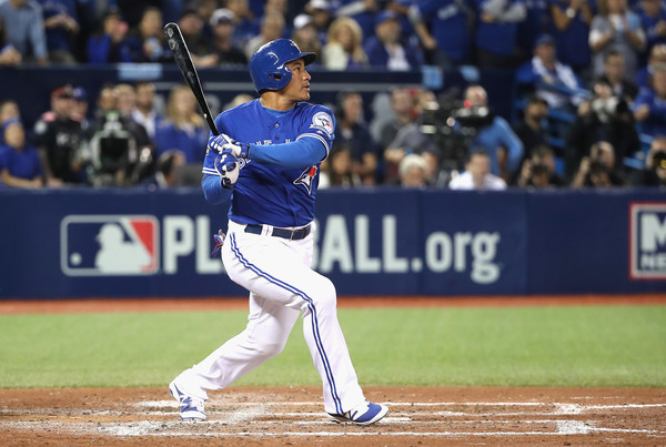Ezequiel Carrera #3 of the Toronto Blue Jays hits an RBI single in the fifth inning against the Baltimore Orioles during the American League Wild Card game at Rogers Centre on October 4, 2016 in Toronto, Canada. (Oct. 3, 2016 - Source: Tom Szczerbowski/Getty Images North America)
