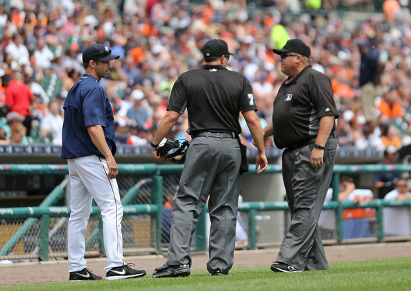 Detroit Tigers manager Brad Ausmus #7 talks with the umpires during the disputed call in the fifth inning of the game against the Cleveland Indians on June 26, 2016 at Comerica Park in Detroit, Michigan. (June 25, 2016 - Source: Leon Halip/Getty Images North America) 