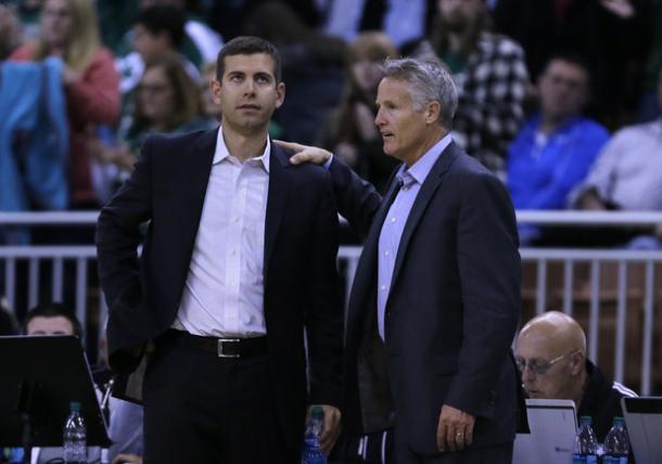 Celtics' coach Brad Stevens (left) and Sixers' coach Brett Brown (right) have a chat during a game (Charles Krupa/AP Photo)