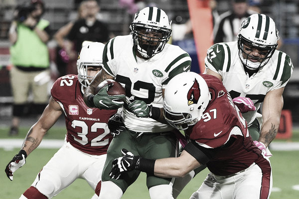 Jets running back Matt Forte is tackled by Josh Mauro and Tyrann Mathieu for a big loss Source: Norm Hall/Getty Images North America