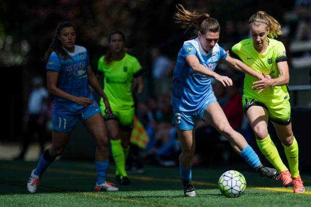 Arin Gilliland of the Chicago Red Stars fights to keep possession when the teams met last season | Source: The Bold