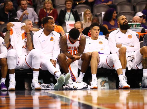 Marquise Chriss and TJ Warren on the bench with their teammates  react on the bench in the fourth quarter against the Portland Trail Blazers at Talking Stick Resort Arena. |Mark J. Rebilas-USA TODAY Sports|