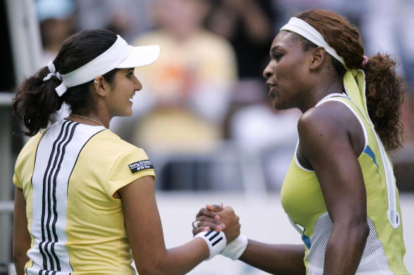 Serena Williams shakes hands with Sania Mirza in their third round match at the 2005 Australian Open (Photo by:JIMIN LAI/AFP/Getty Images)