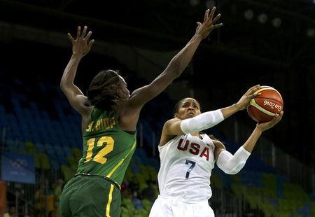 The US' Maya Moore drives on Senegal's Mama Marie Sy during their opening Olympic game/Photo: Shannon Stapleton/Reuters