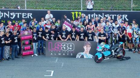 Many took to the track ahead of the races to perform a minute's silence in Salom's honour - www.motogp.com