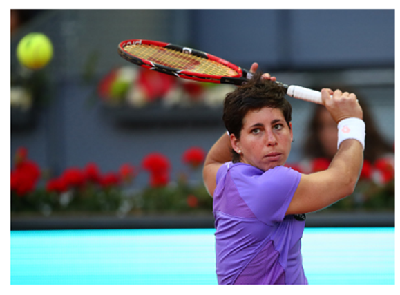 Carla Suarez Navarro of Spain in action against Samantha Stosur of Australia in their third round match during day five of the Mutua Madrid Open tennis tournament at the Caja Magica on May 04, 2016 in Madrid. (Clive Brunskill/Getty)